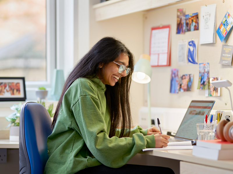 Student working in Lancaster University bedroom