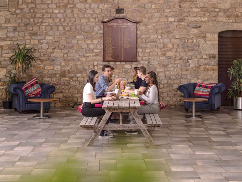 Group of students sitting together at Barker House Farm college café