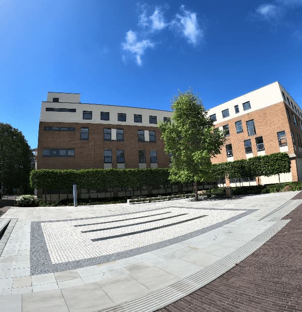 Building, path and trees on Campus