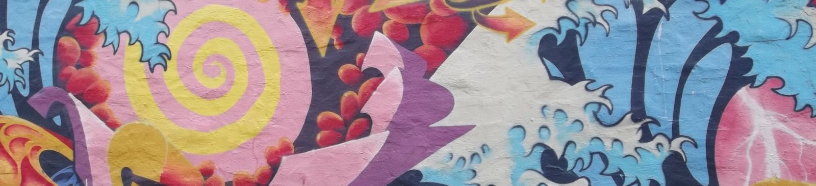 Swirls and waves patterns graffitied on a wall