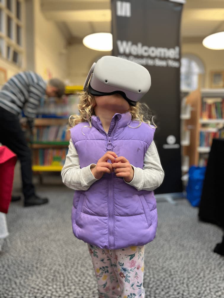 A young boy using a Cyanometer to measure the colour of the sky with AR.