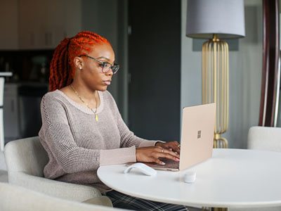 A woman on her laptop.
