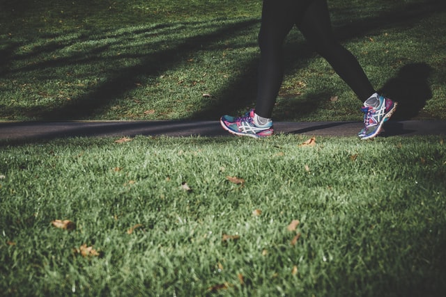 Walking down a grass path.