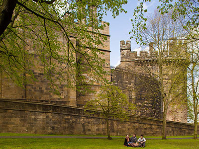 The lighthouse upon the Stone Jetty, in Morecambe, with the mudflats and sea in the distance.