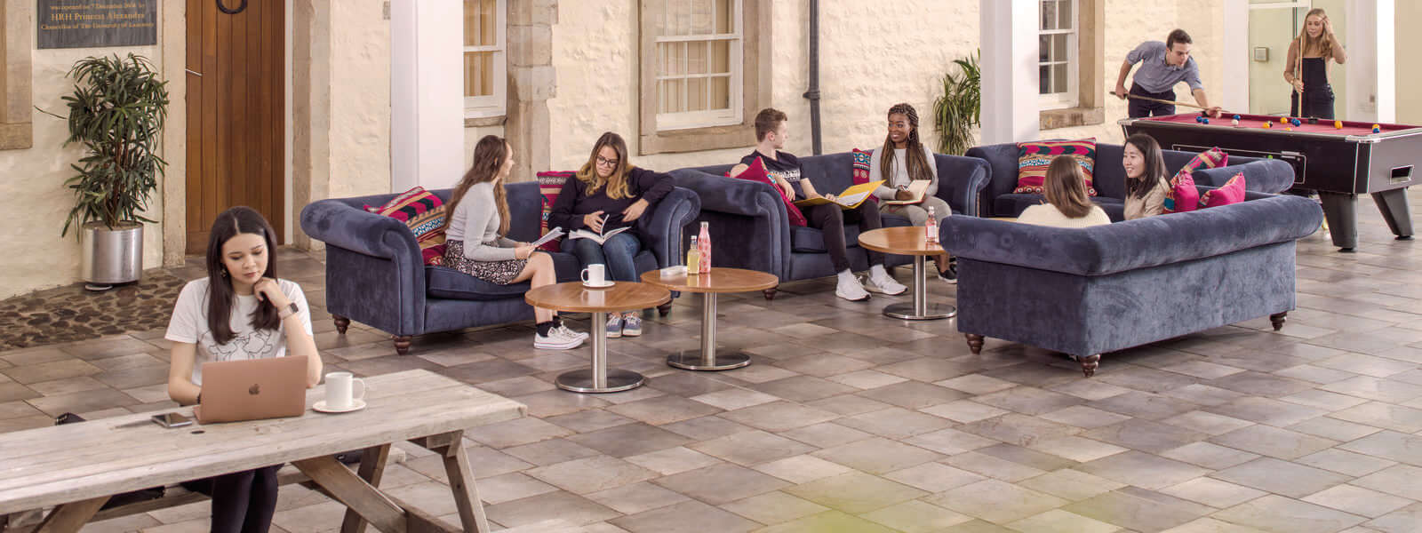 Students socialising in one of the college spaces