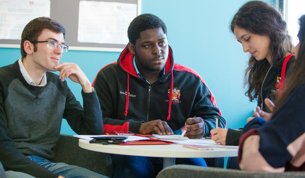 Students sitting having conversation