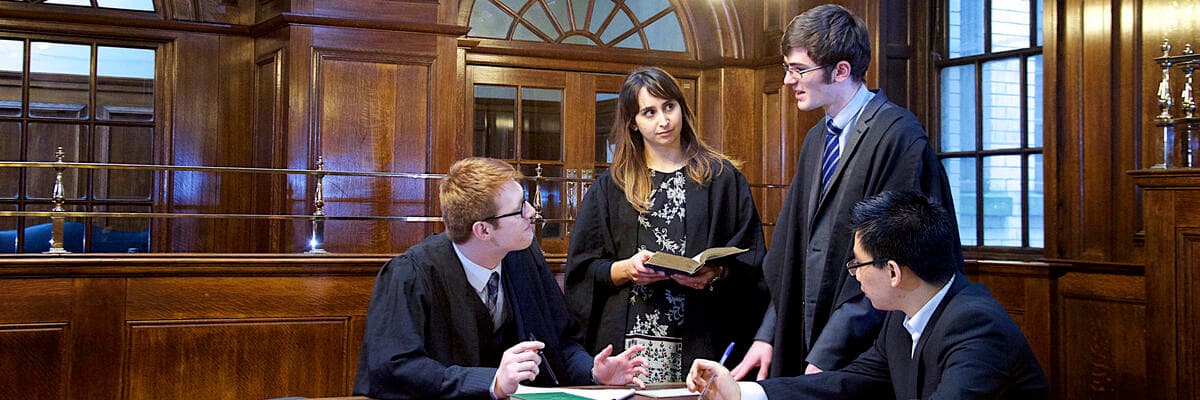 four students in the mock courtroom