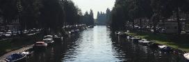 Amsterdam canal with boats