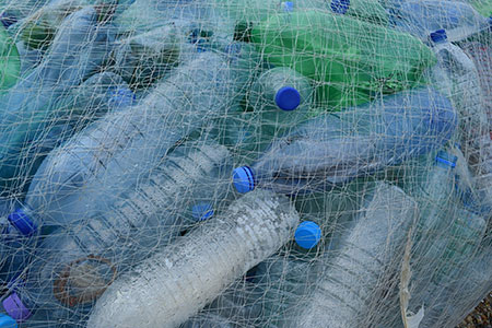 Empty plastic bottles in a nylon fishing net