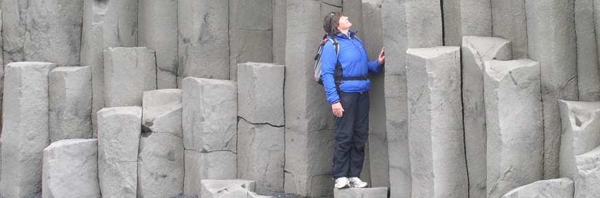 Professor Barbara Maher standing amongst rock formations