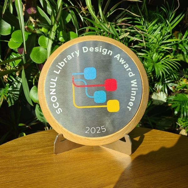 Library Design Award trophy displayed by Lancaster University Library plant wall