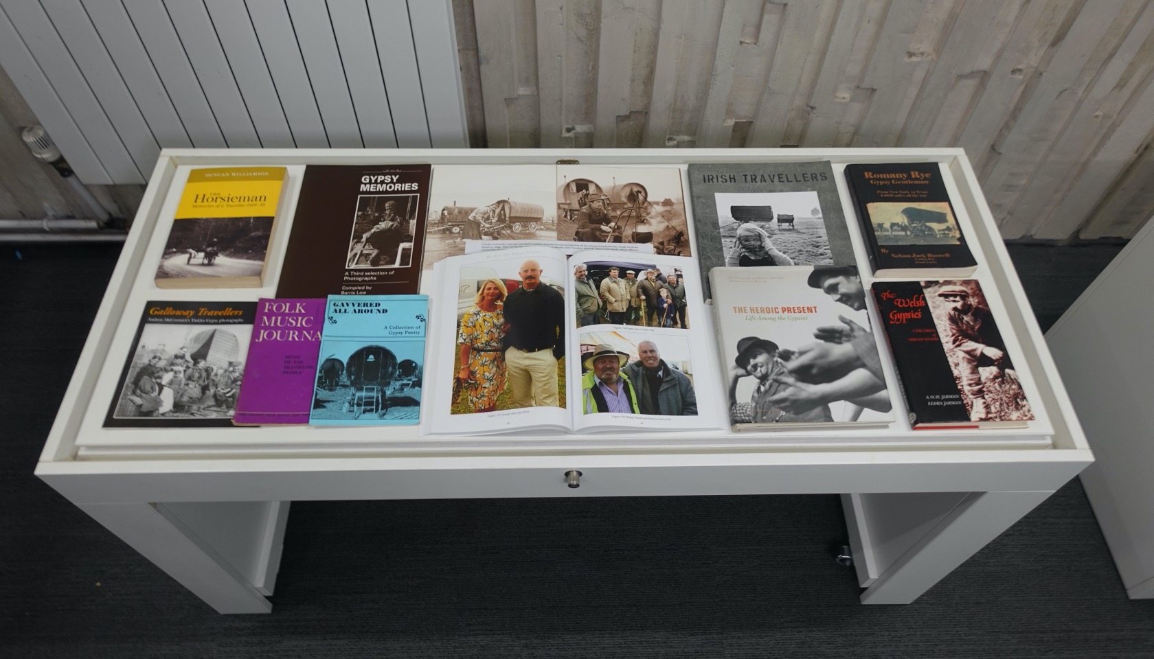 Exhibition case with a selection of books about different traveller communities.