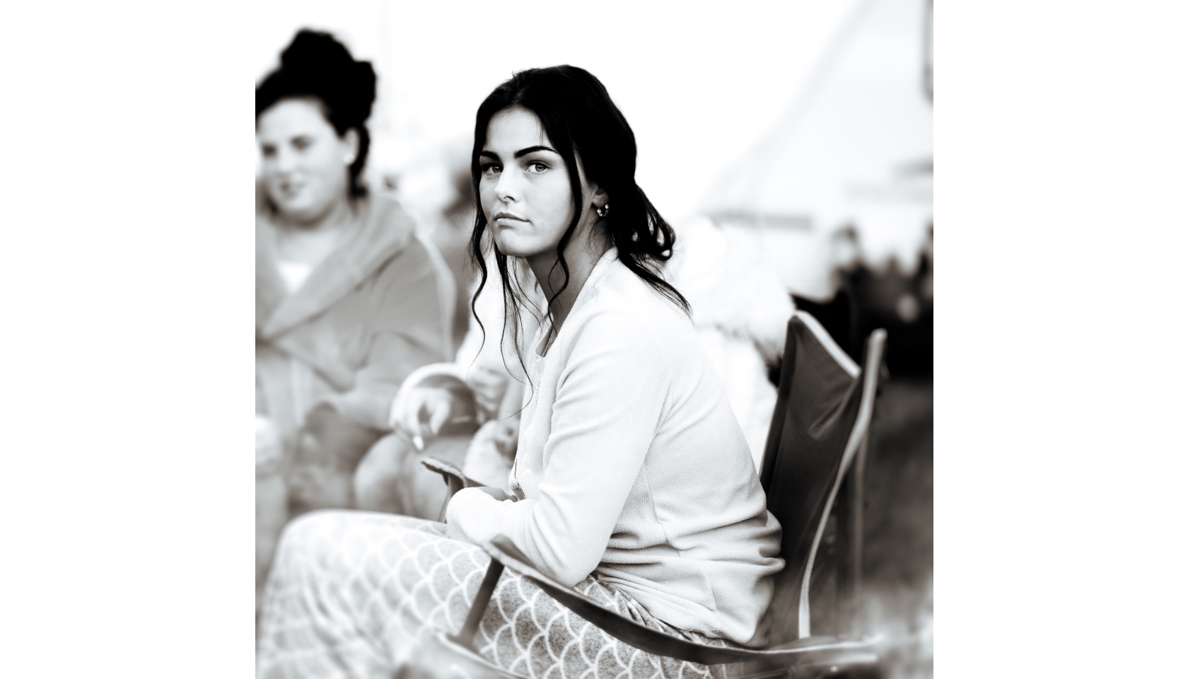 Two women sitting.