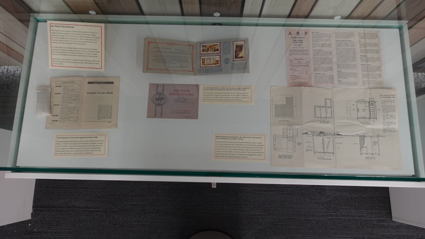 Contents of cabinet showing government publications related to air raid precautions.