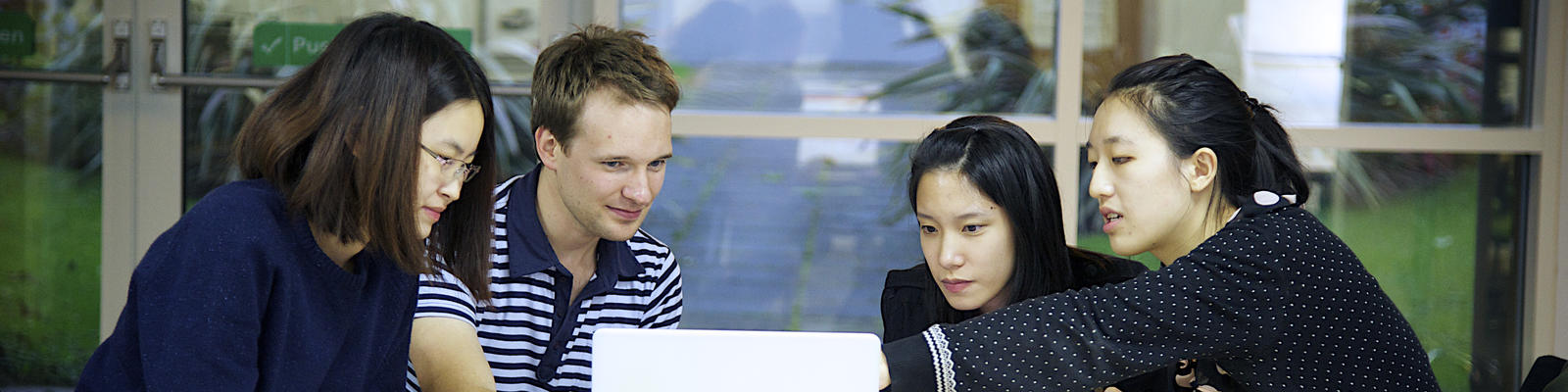 group of students at laptop