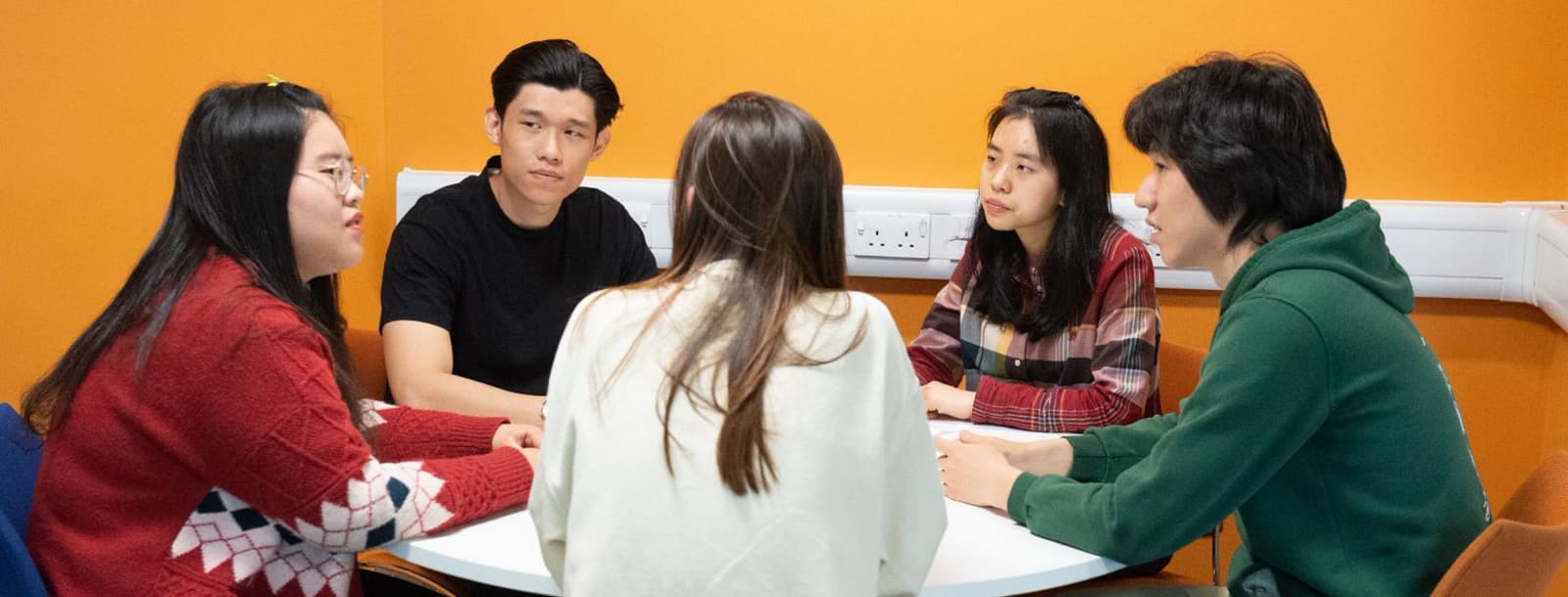 a group of students having a discussion
