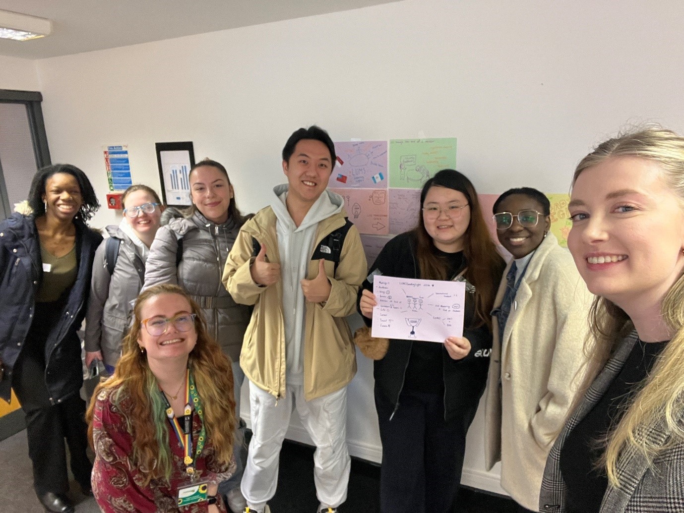 Students and learning developers smiling together