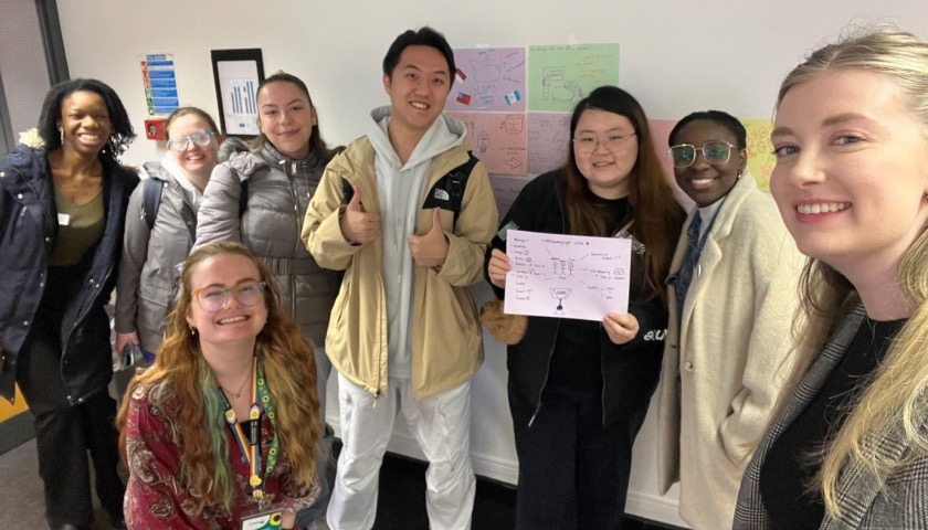 Students and learning developers smiling together