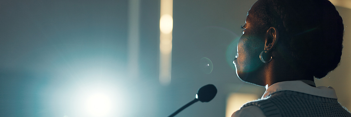 A speaker at a podium