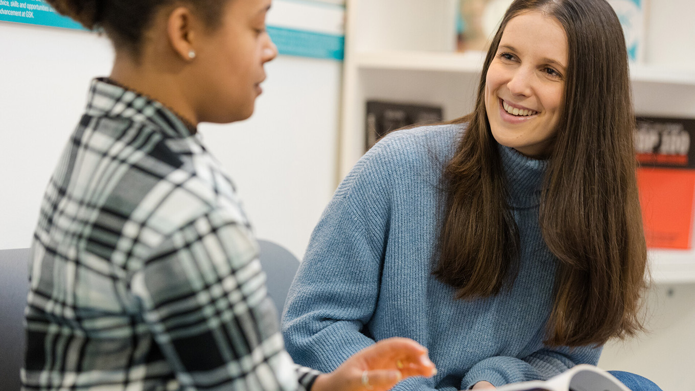 A careers coordinator talking with a student