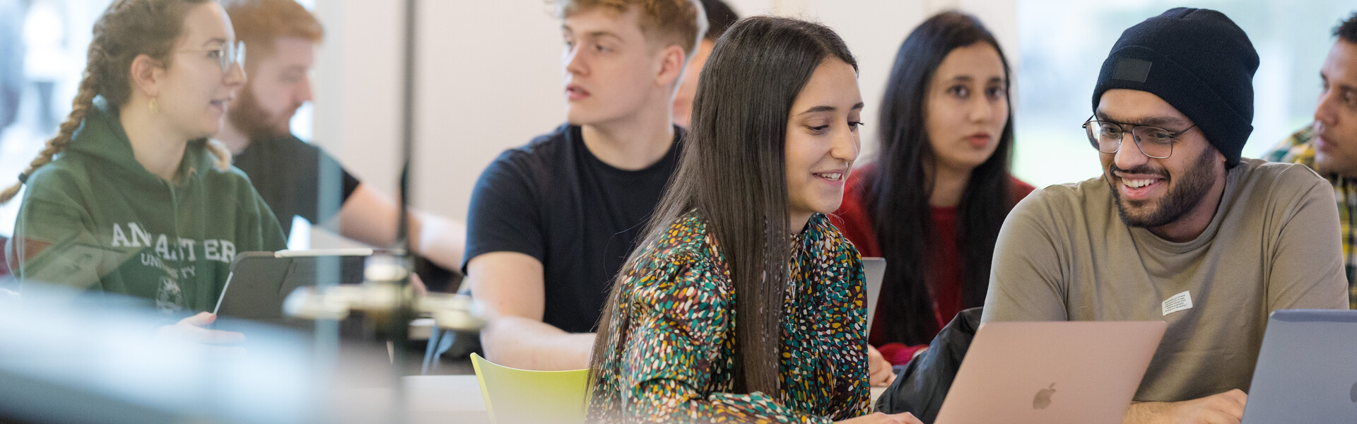 Students discussing work in a classroom