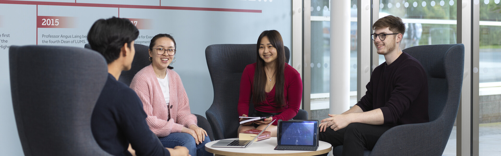 A group of students sitting in reception