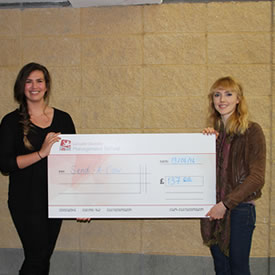 Students pose with their cheque