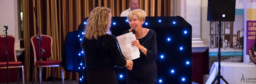 Andrea receiving her award from Professor Sue Cox