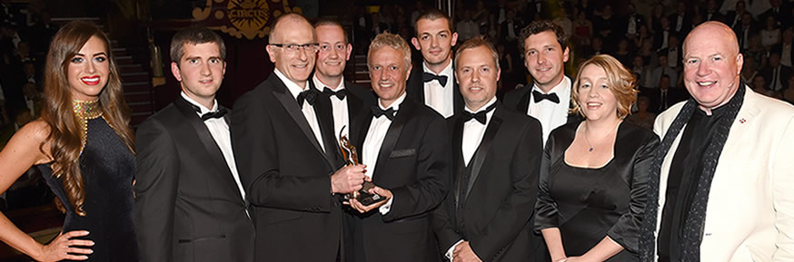TNP being presented with the BIBA New Business of the Year Award by Kevin Roberts, CEO of Saatchi & Saatchi (far right)