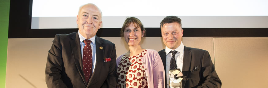 Rob McLoughlin OBE presents the Commercial Engagement Award to Lancaster University's Helen Fogg and Dion Williams