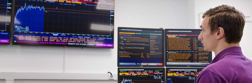 A student examines stock market data in the Bloomberg suite