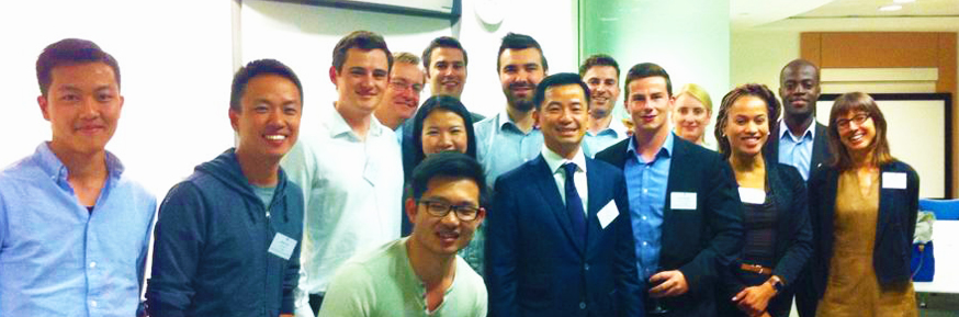 Eric Sim with attendees at his event in London.