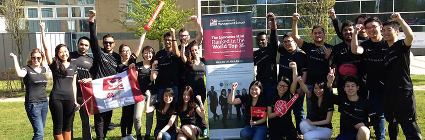 The MBAT team cheering in front of the LUMS building