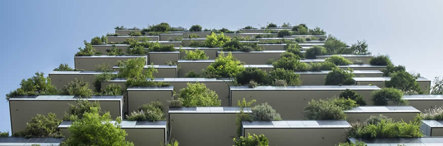 A tall building covered in plants.