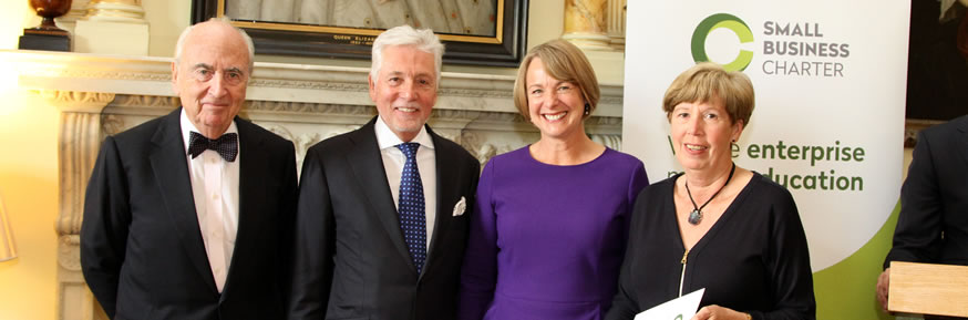Professor Sue Cox and Gill Hall receiving the Gold Award from Lord Young and Sir Peter Bonfield at 10 Downing Street