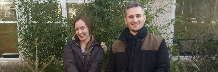 Dr Dmitry Yumashev and Dr Victoria Janes standing next to a re-planted Christmas tree