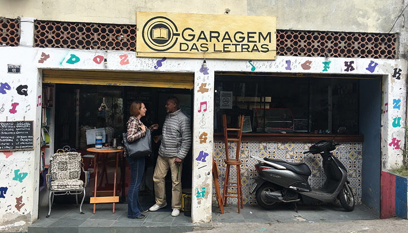 The front of a shop with two people standing outside