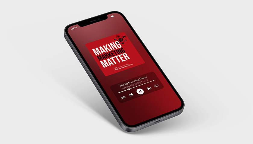 Mobile phone with a Making Marketing Matter podcast graphic on its screen