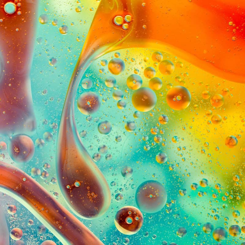 Brightly coloured viscous fluid with bubbles