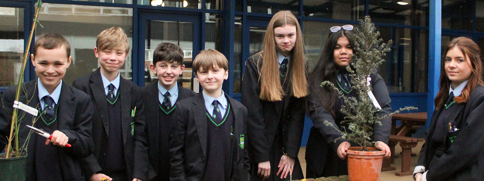 A group of secondary school students participating in a gardening project