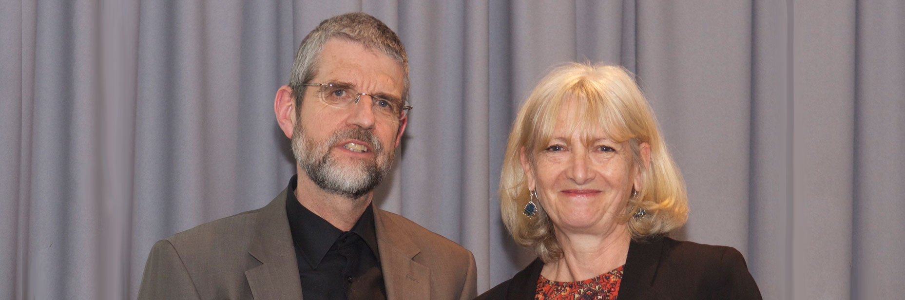 Jane Draycott receives her prize from fellow poet Philip Gross