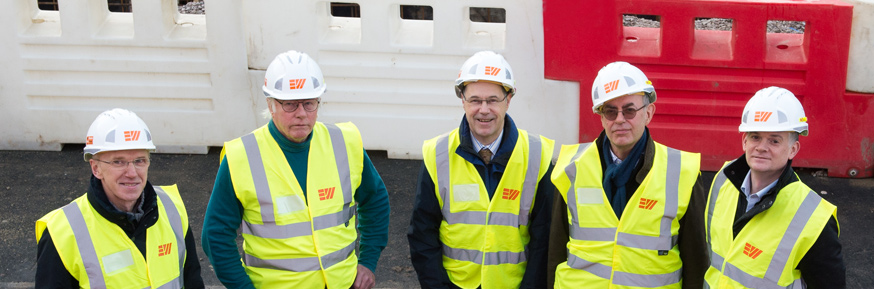 from left: physicists Yuri Pashkin, George Pickett, the Vice-Chancellor, Roger Jones and Rich Haley at the IsoLab site
