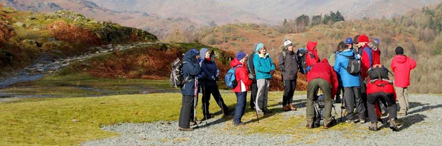 A group of people walking in the hills