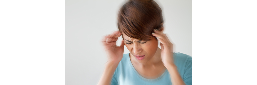 A woman experiencing a migraine