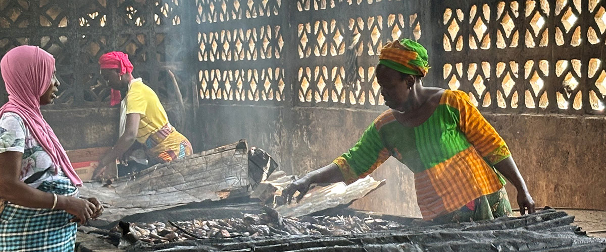 A dried fish seller at a market stall
