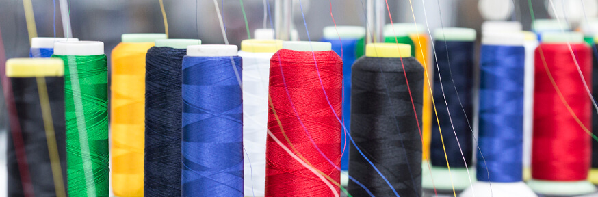 Colourful reels of cotton.