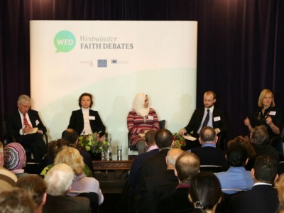 Delegates on stage at a conference