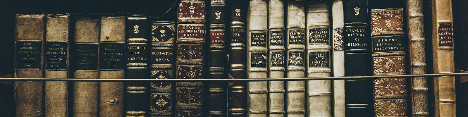 Antique books on a library shelf