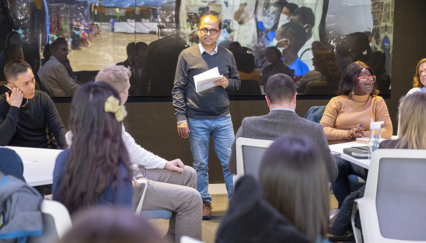 Panel member giving presentation at workshop in the Data Immersion Suite