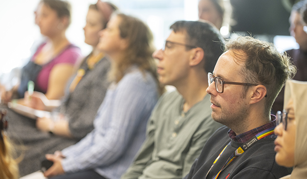 People watching a talk.